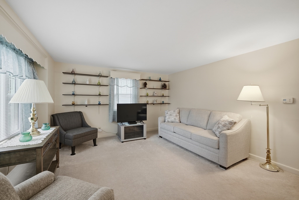 246 El Paso Street Springfield, MA 01104 - Photo 10 of 29 a living room with furniture and a lamp
