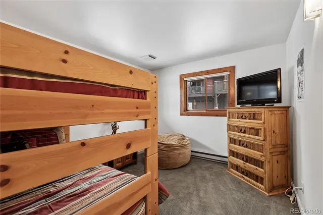 a view of an empty room with a tv