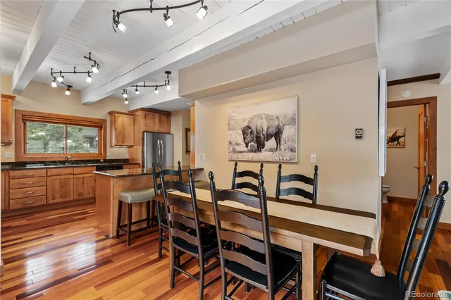 a view of a dining room with furniture window and wooden floor