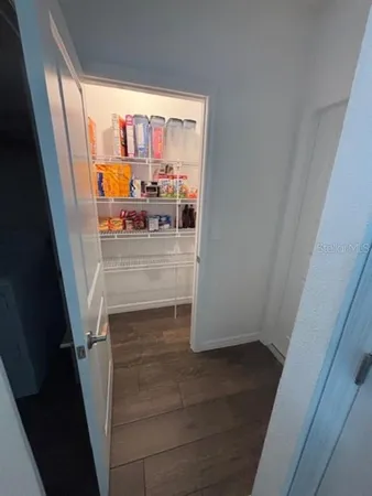 a bathroom with double vanity sink and a mirror