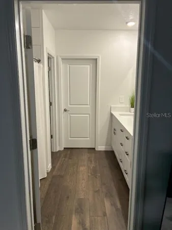 a kitchen with sink refrigerator and microwave
