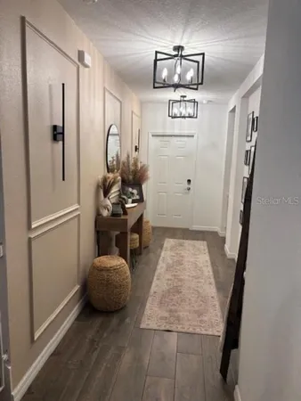 a bedroom with a bed and a mirror