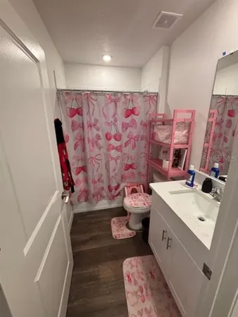 a bathroom with a double vanity sink and mirror
