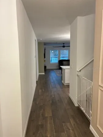 a view of a kitchen from the hallway