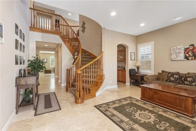 a living room with furniture and a rug