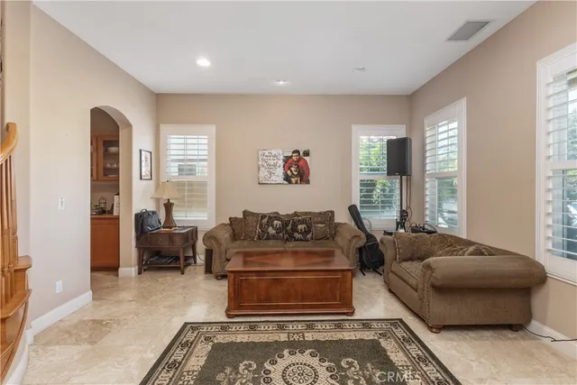 a living room with furniture and a rug
