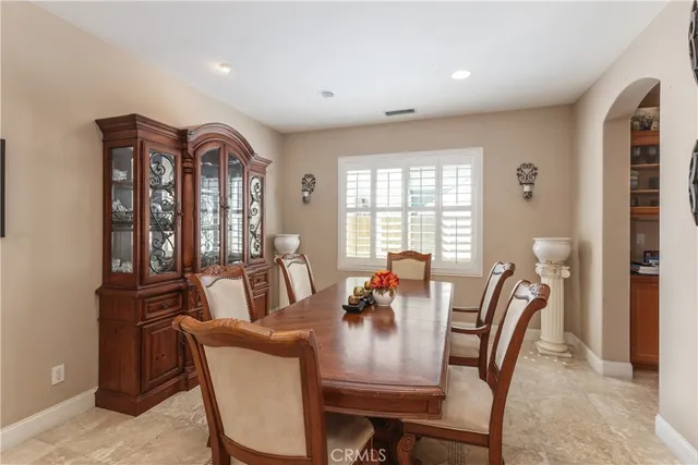 a view of a a dining room with furniture window and outside view