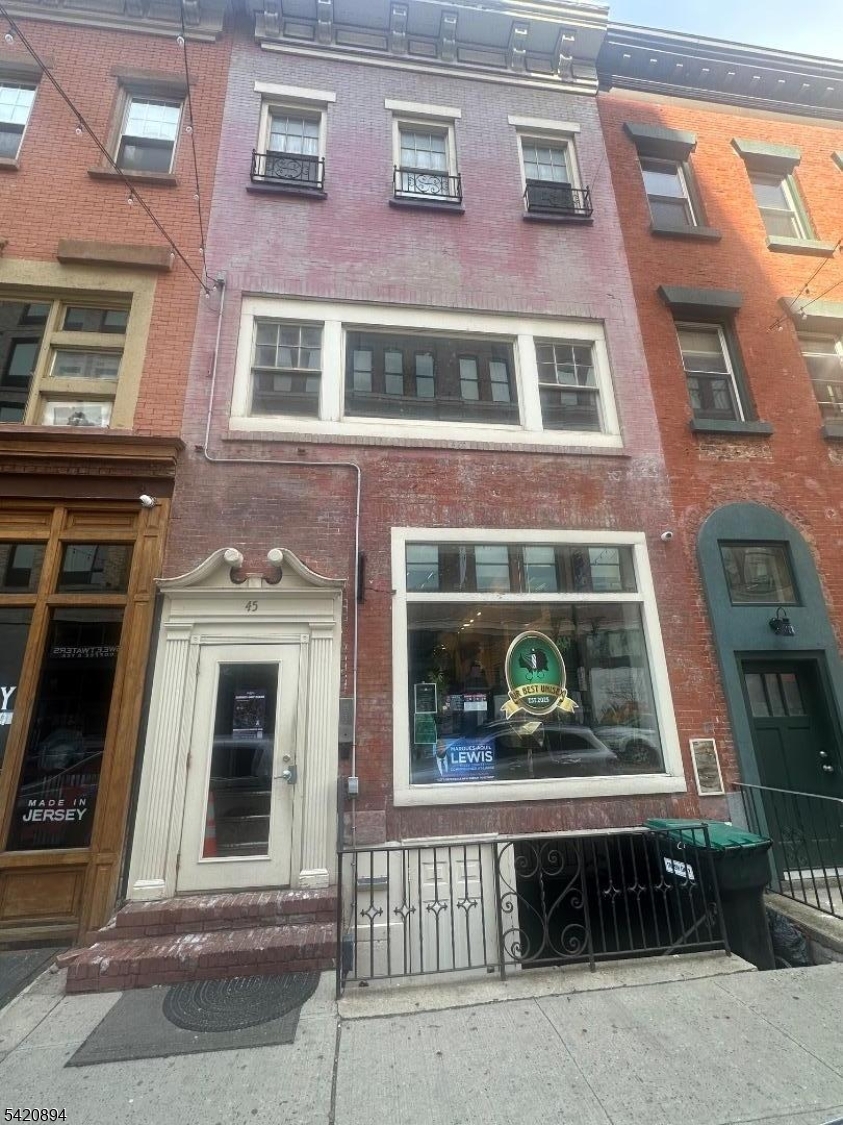 a table and chairs in front of a building