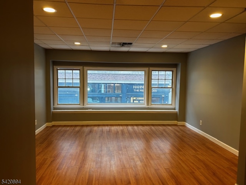 45 Halsey Street Newark, NJ 07102 - Photo 2 of 7 a view of hallway with a large window and wooden floor