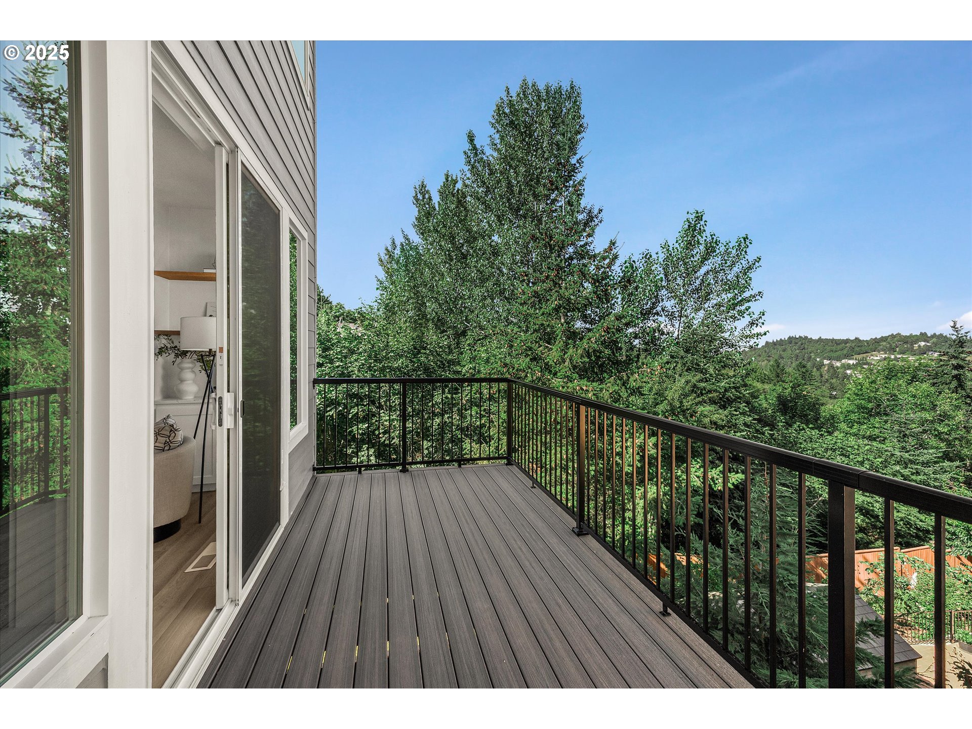 7026 Southeast 156th Avenue Portland, OR 97236 - Photo 18 of 48 a balcony with wooden floor and city view