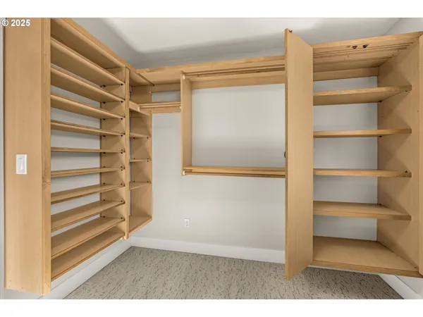 a view of closet area with empty racks