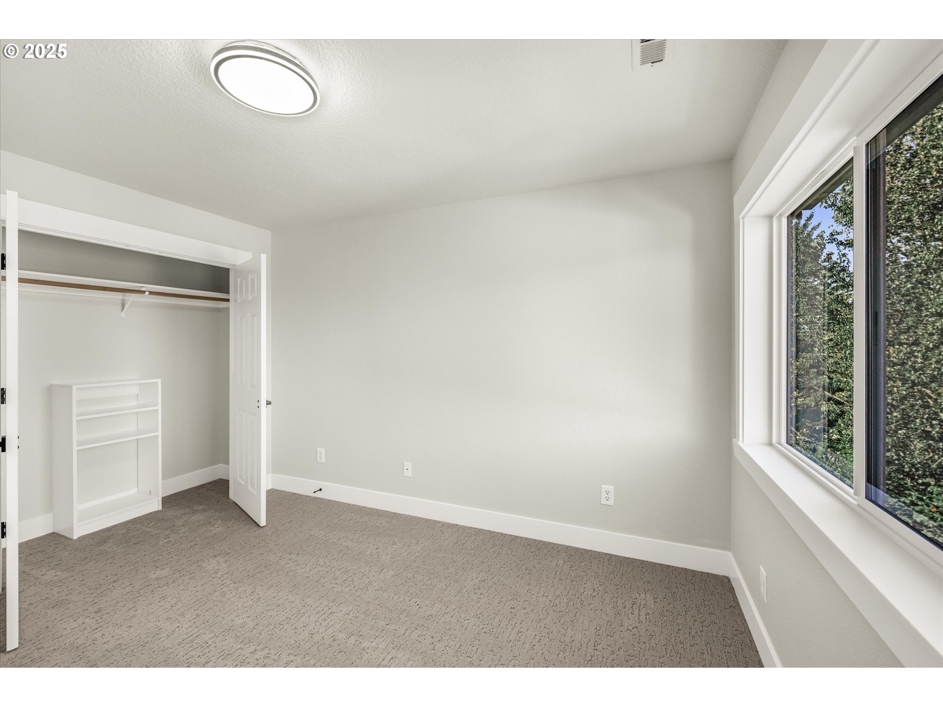 7026 Southeast 156th Avenue Portland, OR 97236 - Photo 26 of 48 a view of an empty room with a window