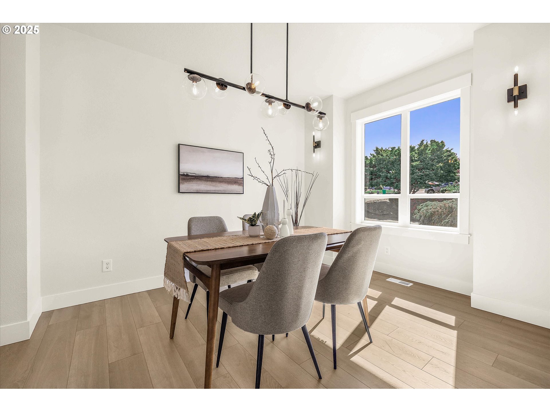 7026 Southeast 156th Avenue Portland, OR 97236 - Photo 7 of 48 a view of a dining room with furniture window and wooden floor