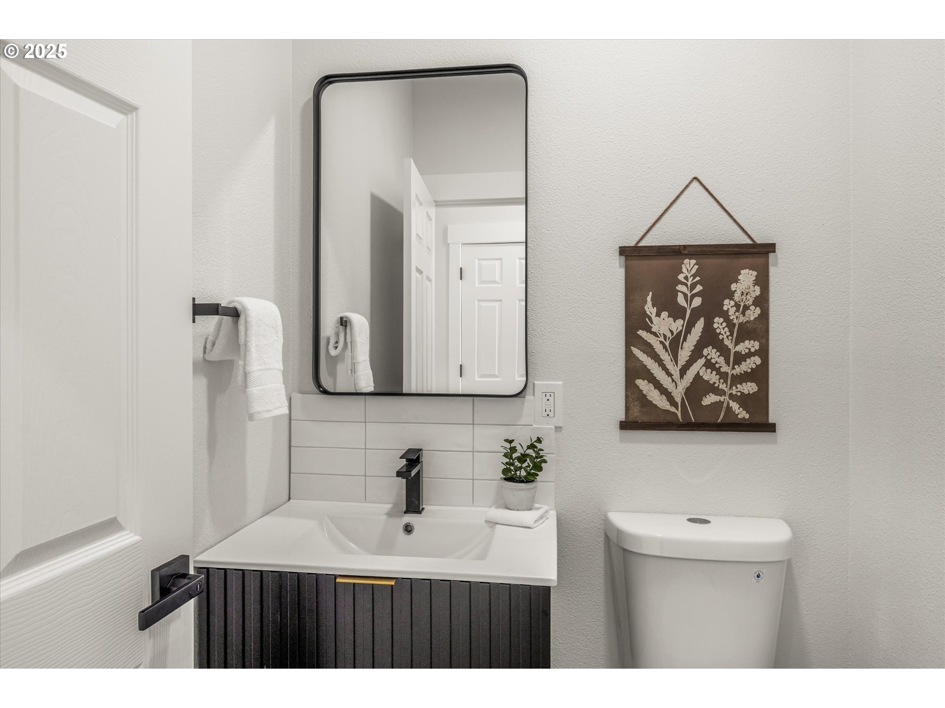 7026 Southeast 156th Avenue Portland, OR 97236 - Photo 8 of 48 a bathroom with a sink and a mirror