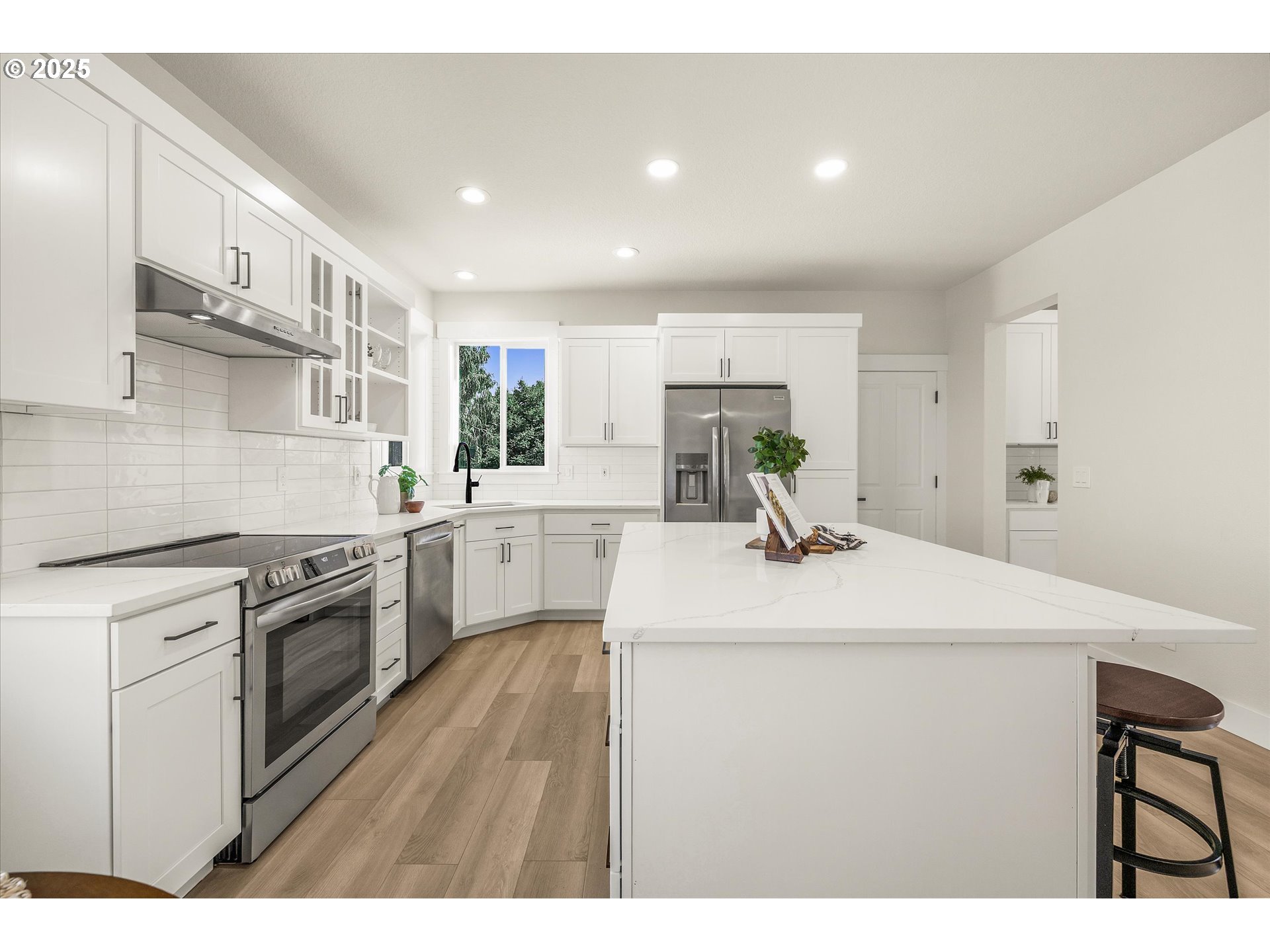 7026 Southeast 156th Avenue Portland, OR 97236 - Photo 10 of 48 a kitchen with a sink appliances and cabinets
