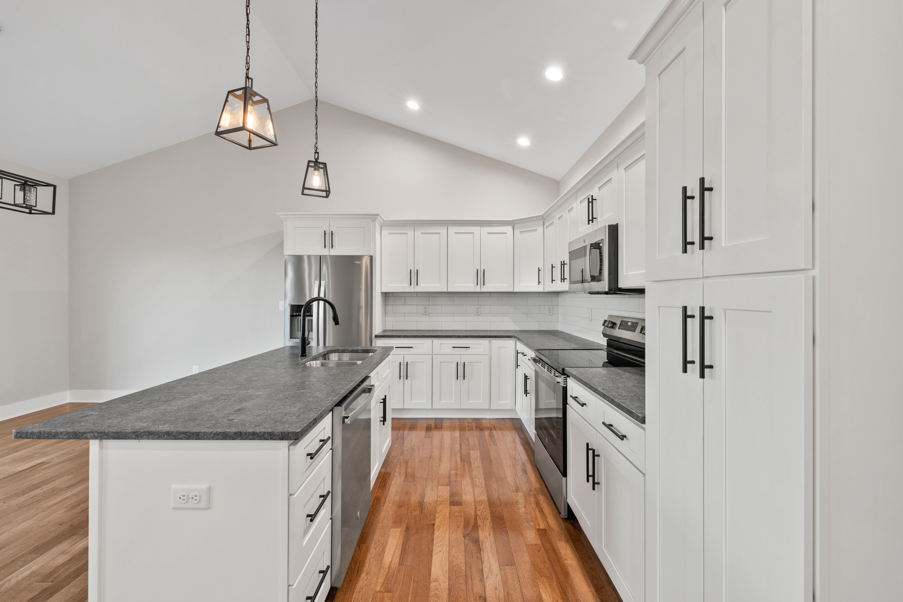 136 Chamberlain Drive Staunton, VA 24401 - Photo 20 of 74 a kitchen with kitchen island granite countertop lots of counter top space and stainless steel appliances