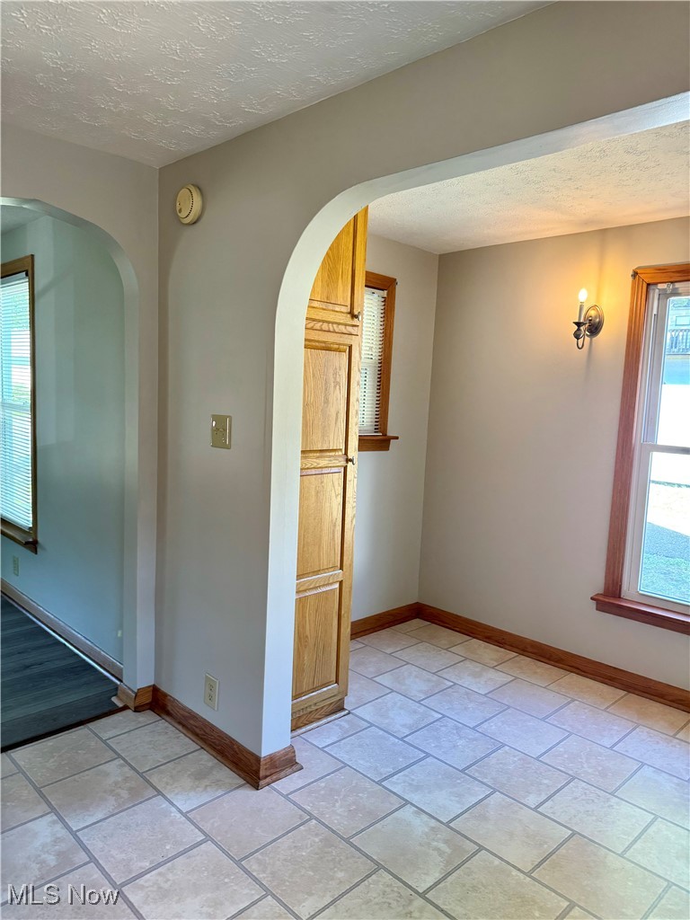 1655 Spring Street Coshocton, OH 43812 - Photo 8 of 19 Spare room featuring a textured ceiling