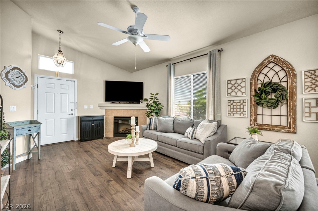 2305 West Horizon Ridge Parkway, Unit 3621 Henderson, NV 89052 - Photo 20 of 23 Hardwood floors and vaulted ceilings create an inviting atmosphere in this sun-filled living space.