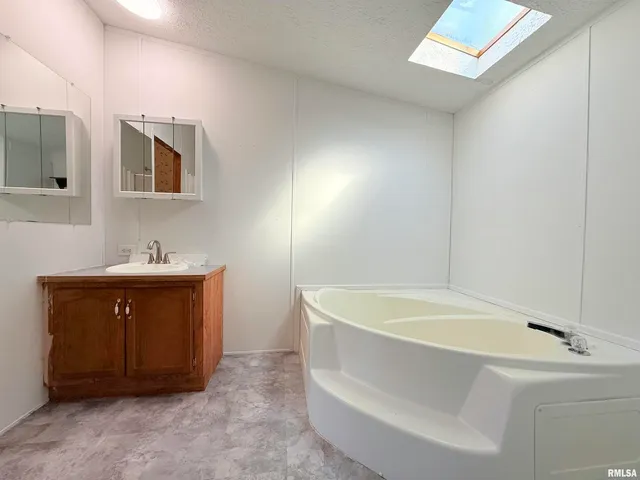 a bathroom with a sink and a bathtub