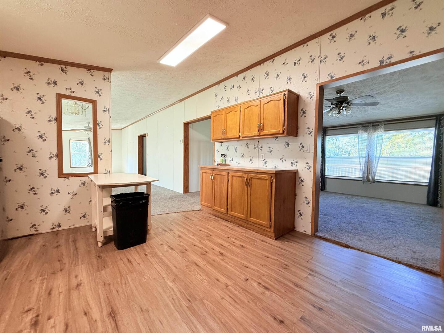 125 Beech Hollow Road Harrisburg, IL 62946 - Photo 24 of 33 a view of a kitchen with wooden floor and electronic appliances
