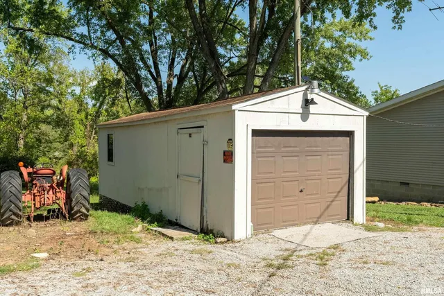 a backyard of a house with garage
