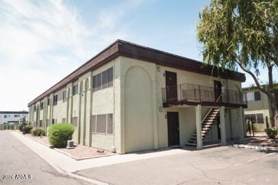 424 West Brown Road, Unit 245 Mesa, AZ 85201 - Photo 1 of 9 a front view of a house with a garden