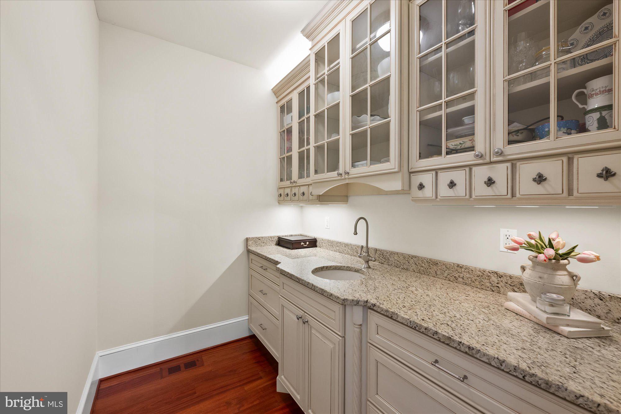 11512 Morning Ride Drive Potomac, MD 20854 - Photo 13 of 51 a kitchen with a sink and cabinets