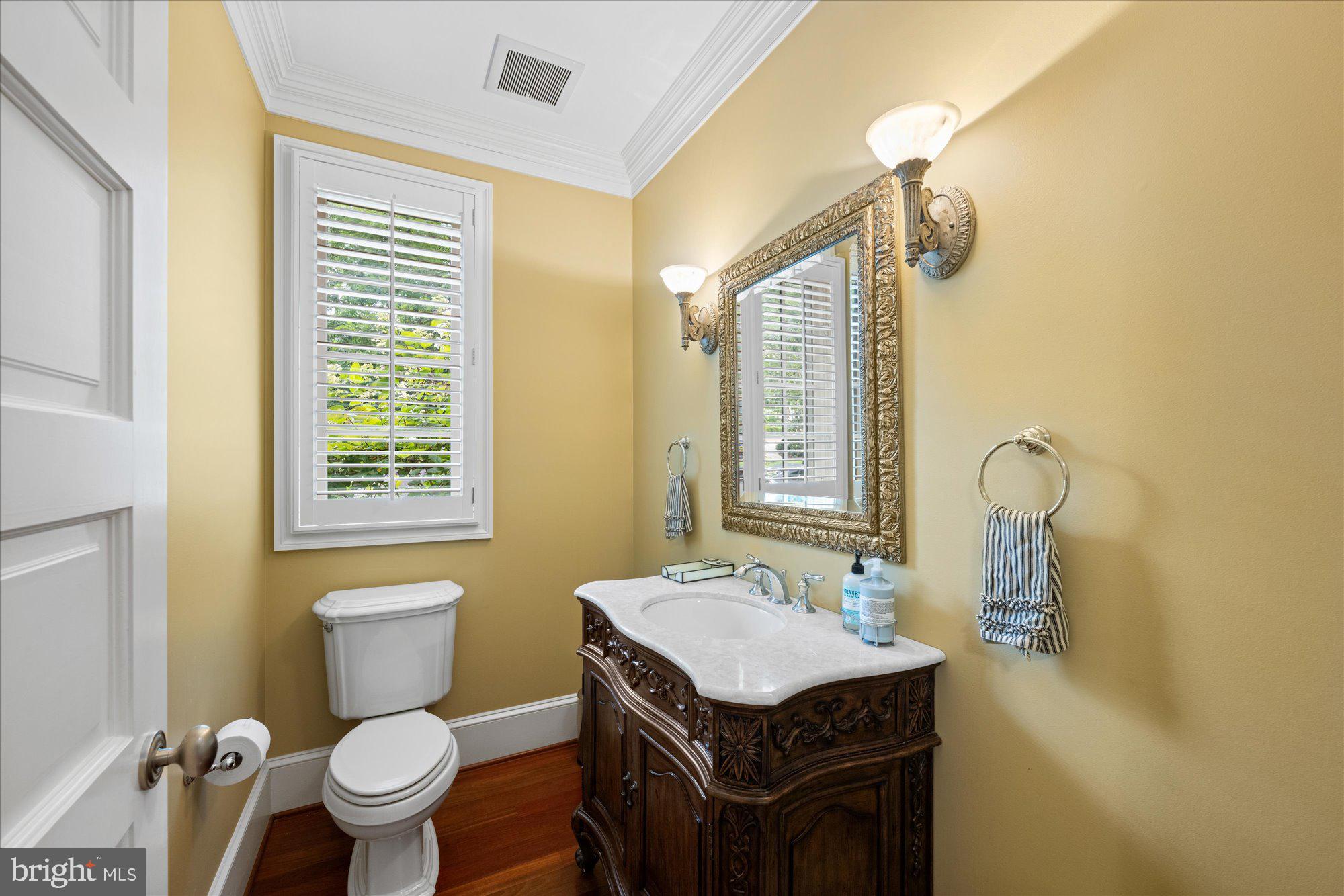 11512 Morning Ride Drive Potomac, MD 20854 - Photo 21 of 51 a bathroom with a sink a toilet and a mirror