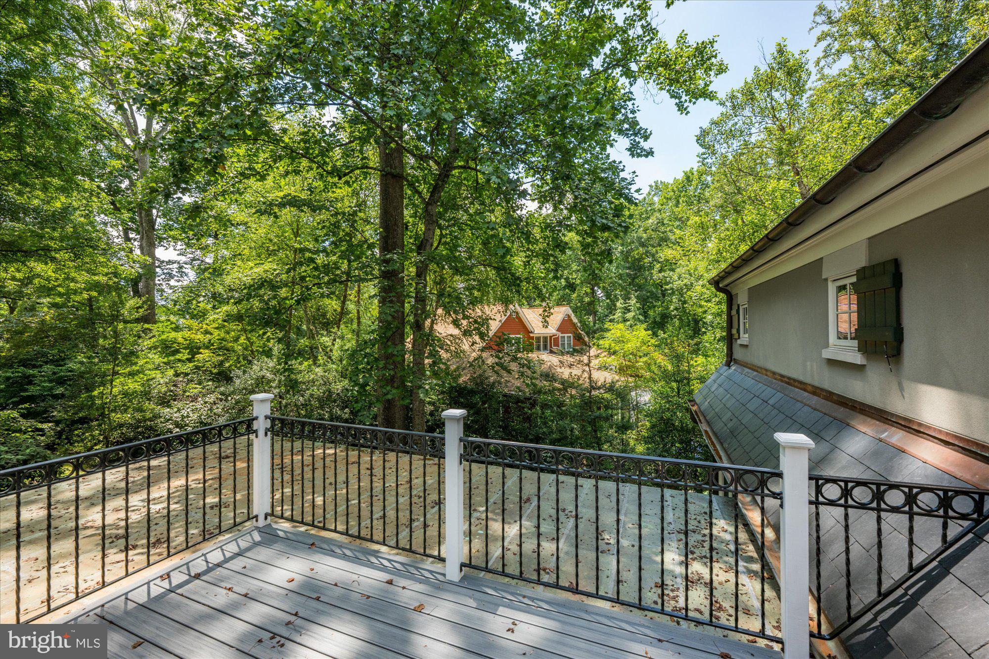 11512 Morning Ride Drive Potomac, MD 20854 - Photo 35 of 51 a balcony with wooden floor and fence