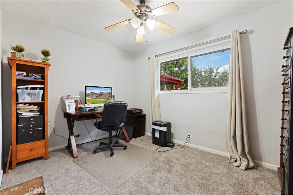 424 Morada Lane Stockton, CA 95210 - Photo 13 of 51 a view of a workspace with furniture and a window
