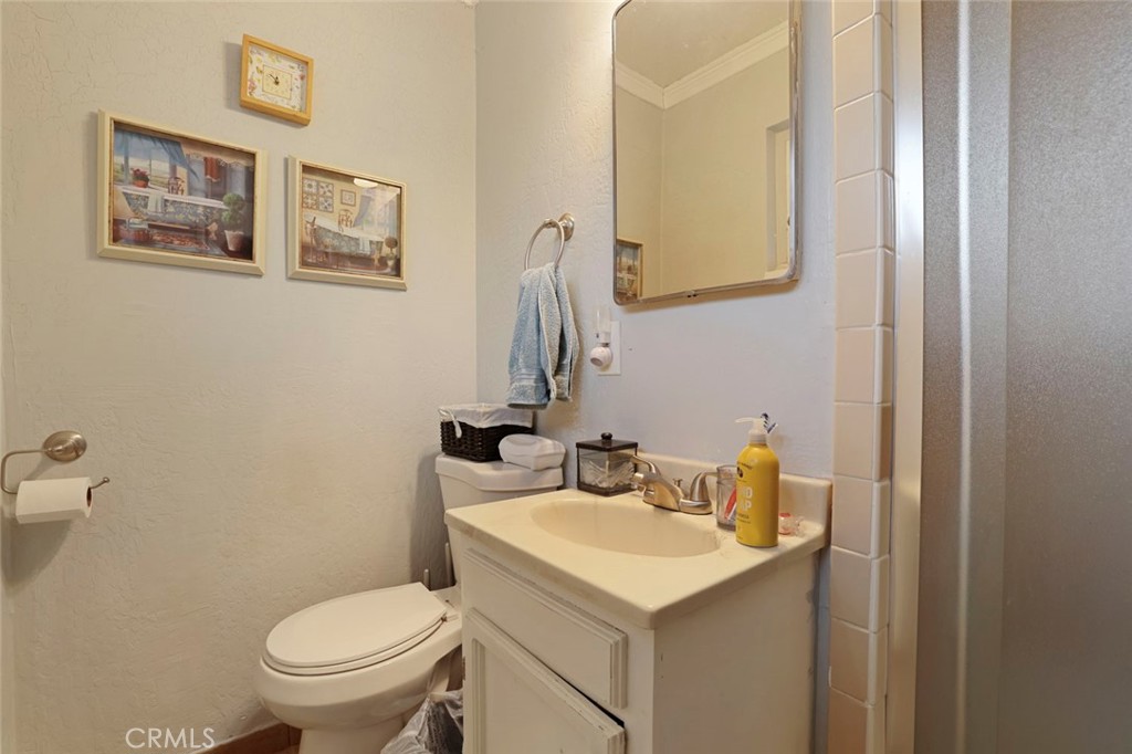 424 Morada Lane Stockton, CA 95210 - Photo 19 of 51 a bathroom with a toilet sink and mirror