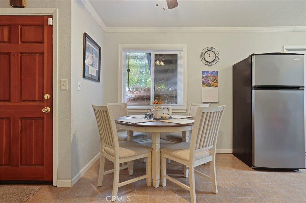 424 Morada Lane Stockton, CA 95210 - Photo 23 of 51 a view of a dining room with furniture and a refrigerator