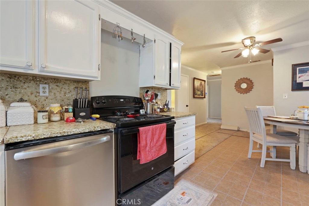 424 Morada Lane Stockton, CA 95210 - Photo 26 of 51 a kitchen with stainless steel appliances granite countertop a stove a sink and a refrigerator