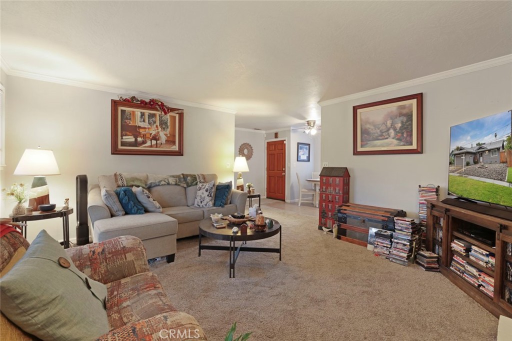 424 Morada Lane Stockton, CA 95210 - Photo 28 of 51 a living room with furniture and a flat screen tv