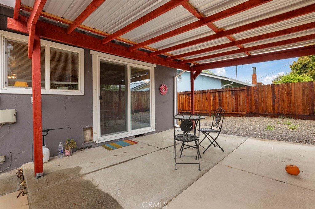 424 Morada Lane Stockton, CA 95210 - Photo 30 of 51 a patio with a table and chairs