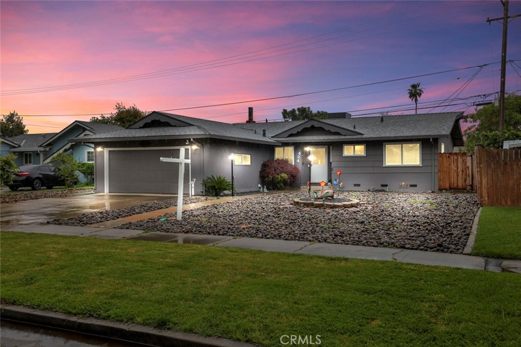 424 Morada Lane Stockton, CA 95210 - Photo 4 of 51 a front view of a house with a garden