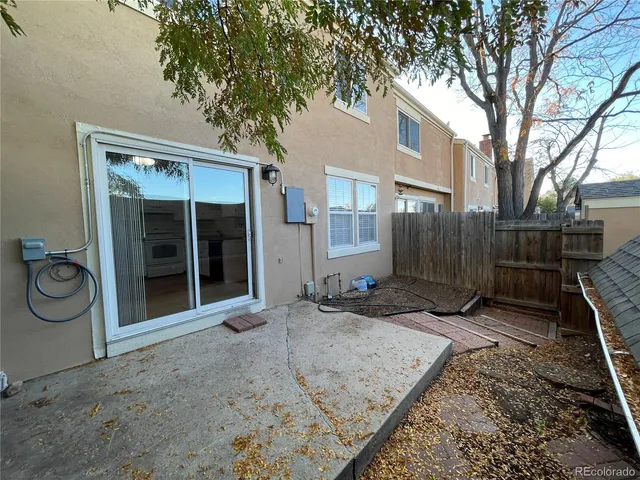a backyard of a house with seating space