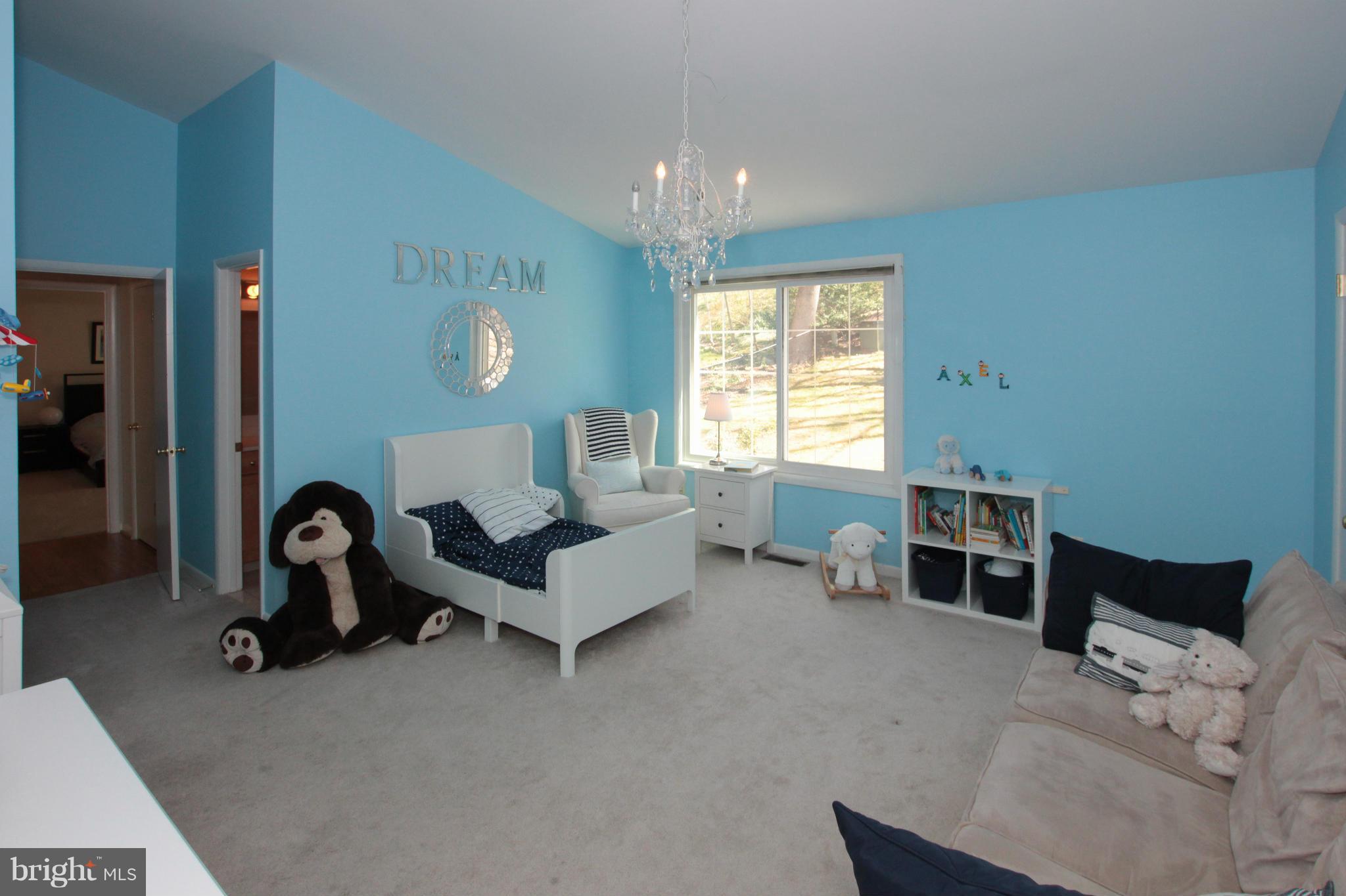 1329 Merrie Ridge Road McLean, VA 22101 - Photo 22 of 30 a living room with furniture a window and gym equipment