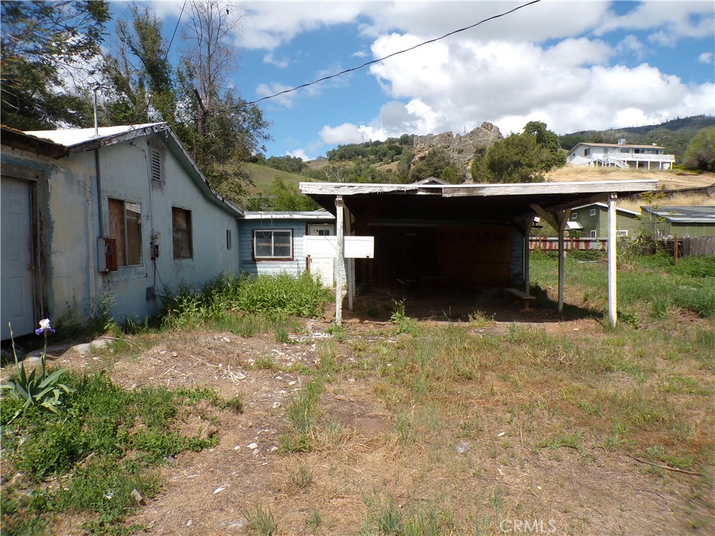 4546 Foothill Drive Lucerne, CA 95458 - Photo 2 of 5 a backyard of a house with a yard and garage