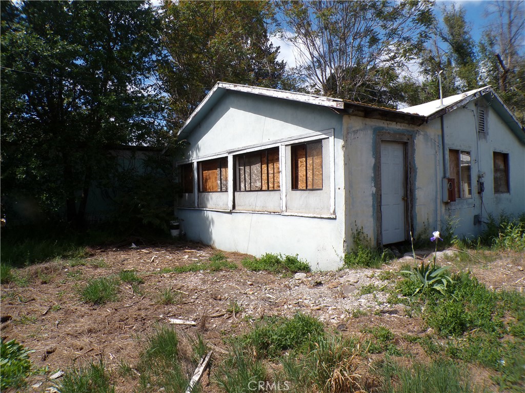 4546 Foothill Drive Lucerne, CA 95458 - Photo 3 of 5 a view of a house with yard and trees in the background