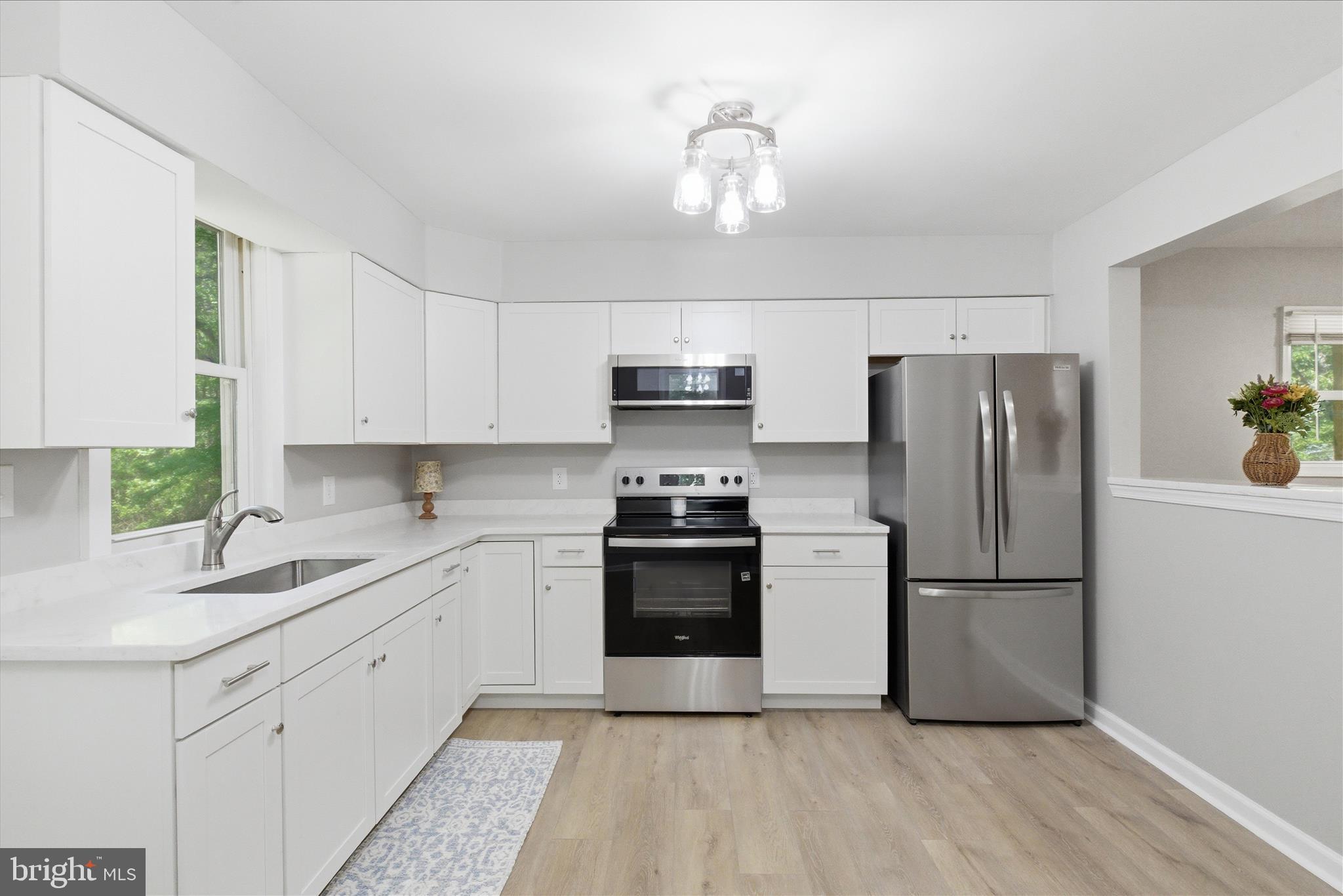 6815 Marshall Road St. Leonard, MD 20685 - Photo 11 of 43 a kitchen with a sink stainless steel appliances and cabinets