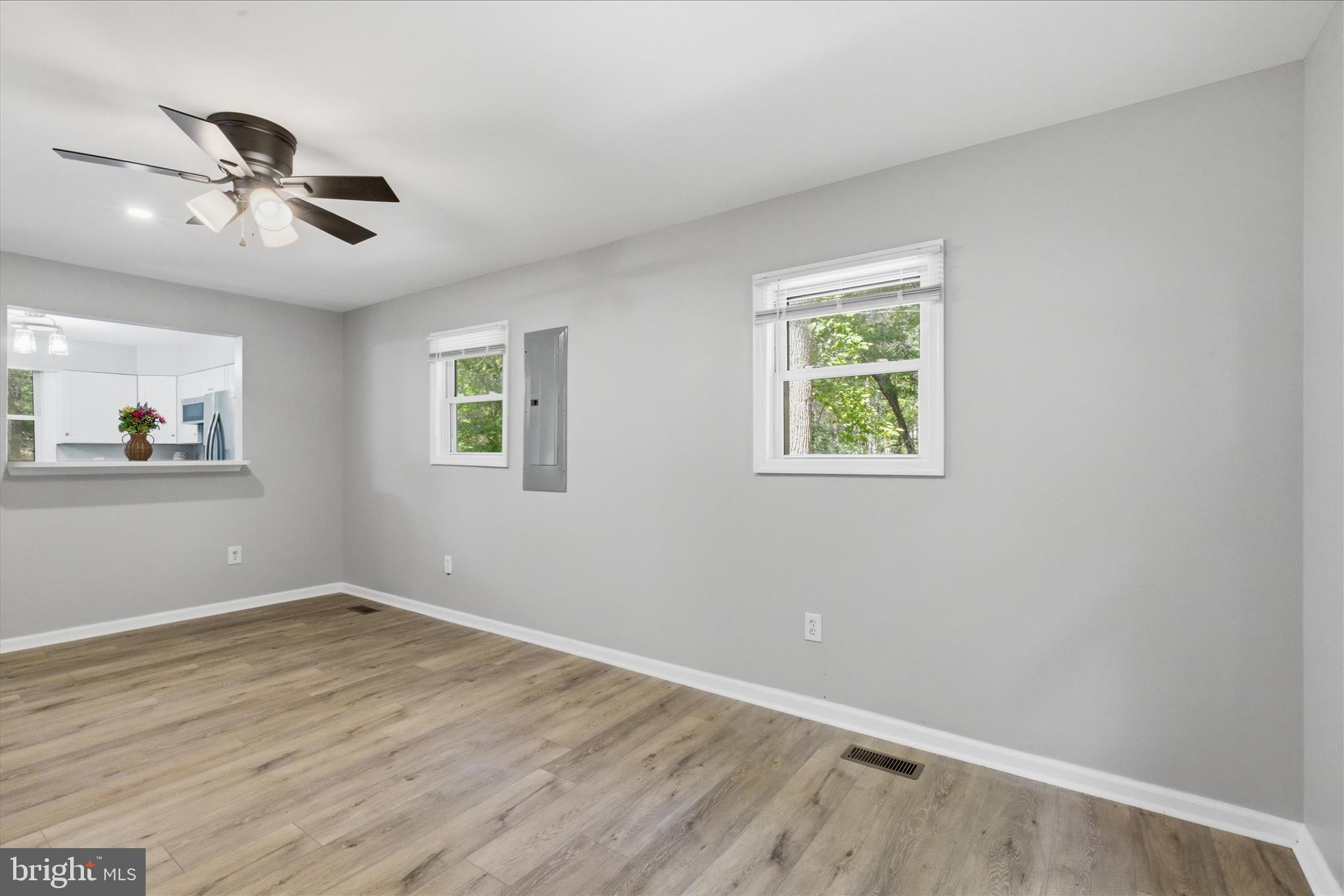 6815 Marshall Road St. Leonard, MD 20685 - Photo 17 of 43 a view of room with hardwood floor and window