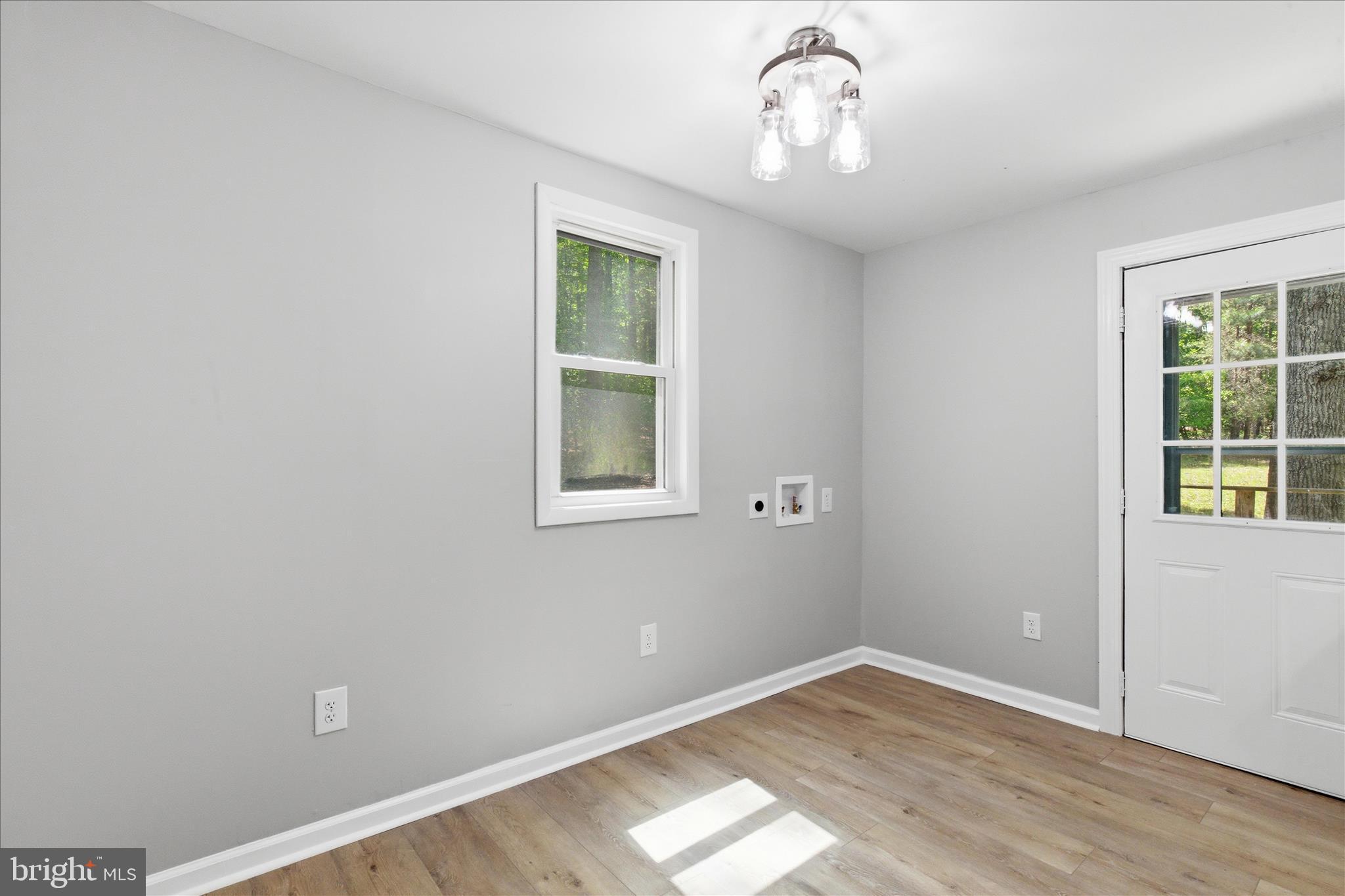 6815 Marshall Road St. Leonard, MD 20685 - Photo 20 of 43 wooden floor in an empty room with a window