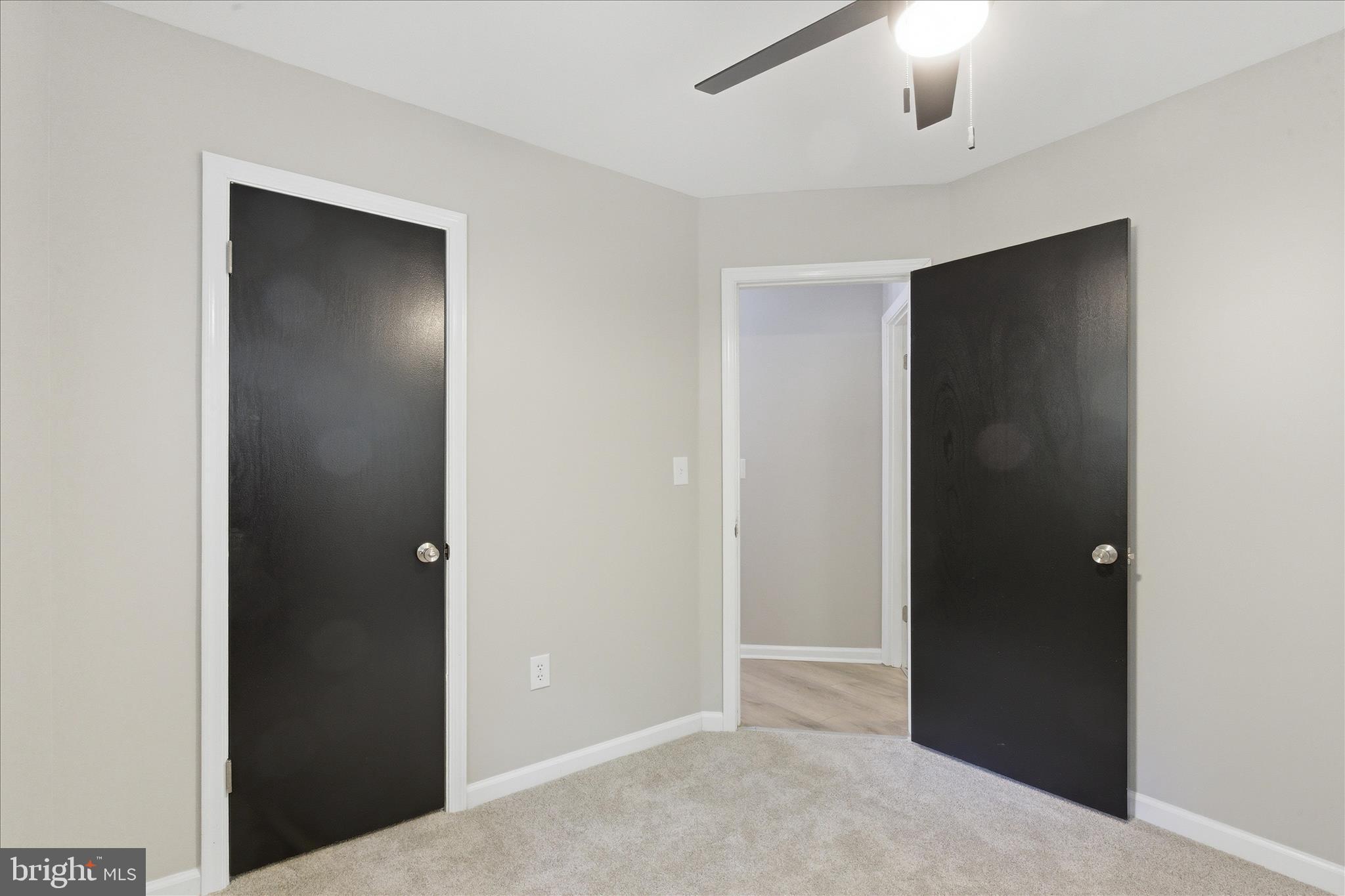 6815 Marshall Road St. Leonard, MD 20685 - Photo 26 of 43 an empty room with closet and a chandelier fan