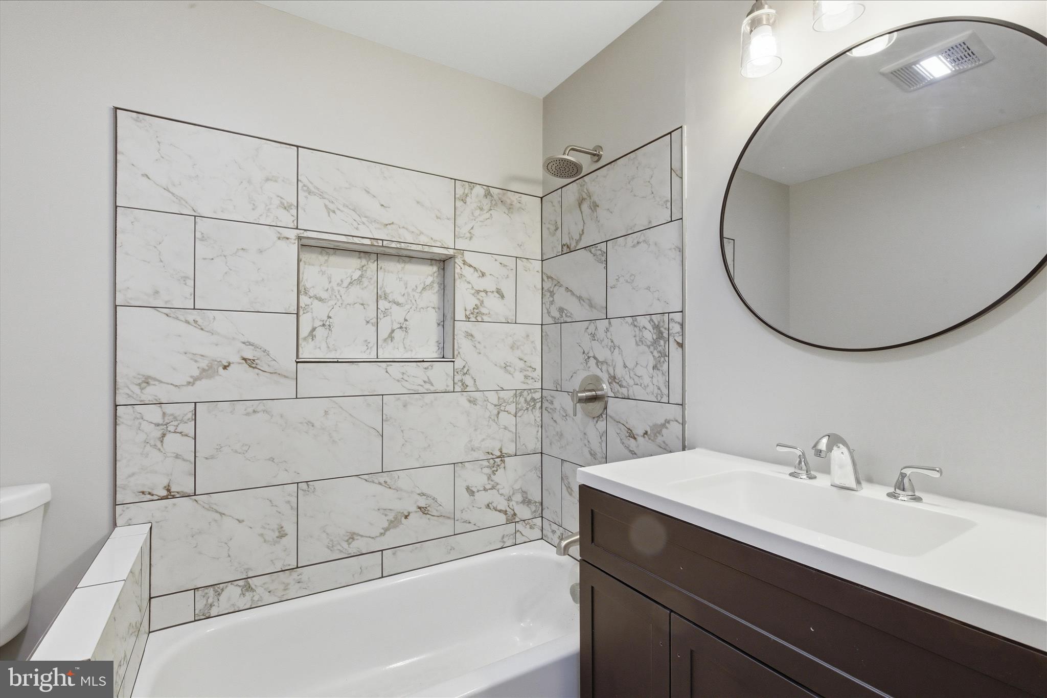 6815 Marshall Road St. Leonard, MD 20685 - Photo 27 of 43 a bathroom with a sink and a mirror