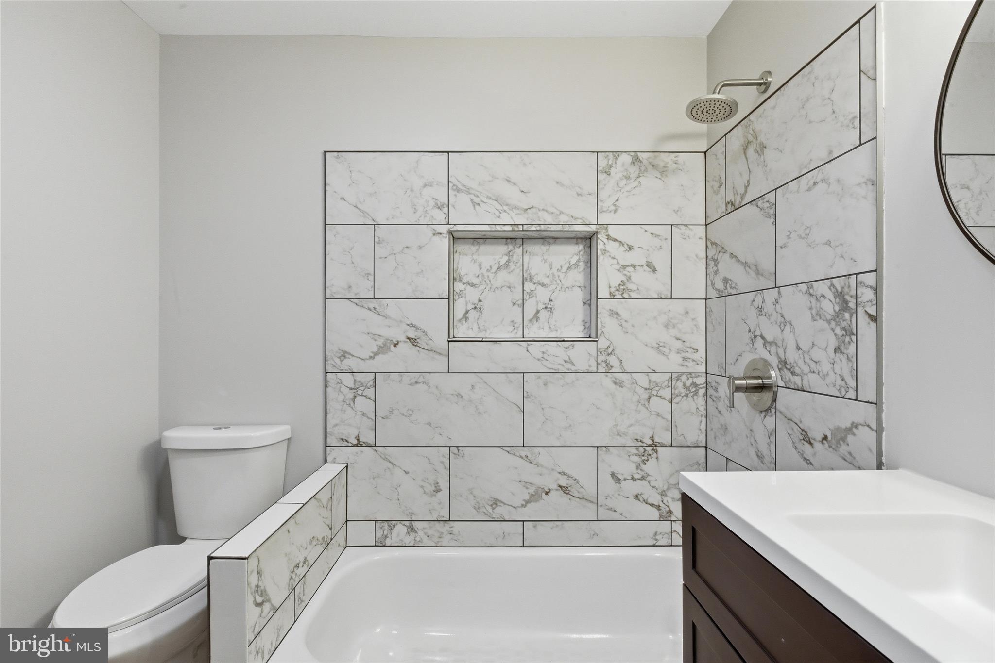 6815 Marshall Road St. Leonard, MD 20685 - Photo 28 of 43 a bathroom with a sink a toilet and shower