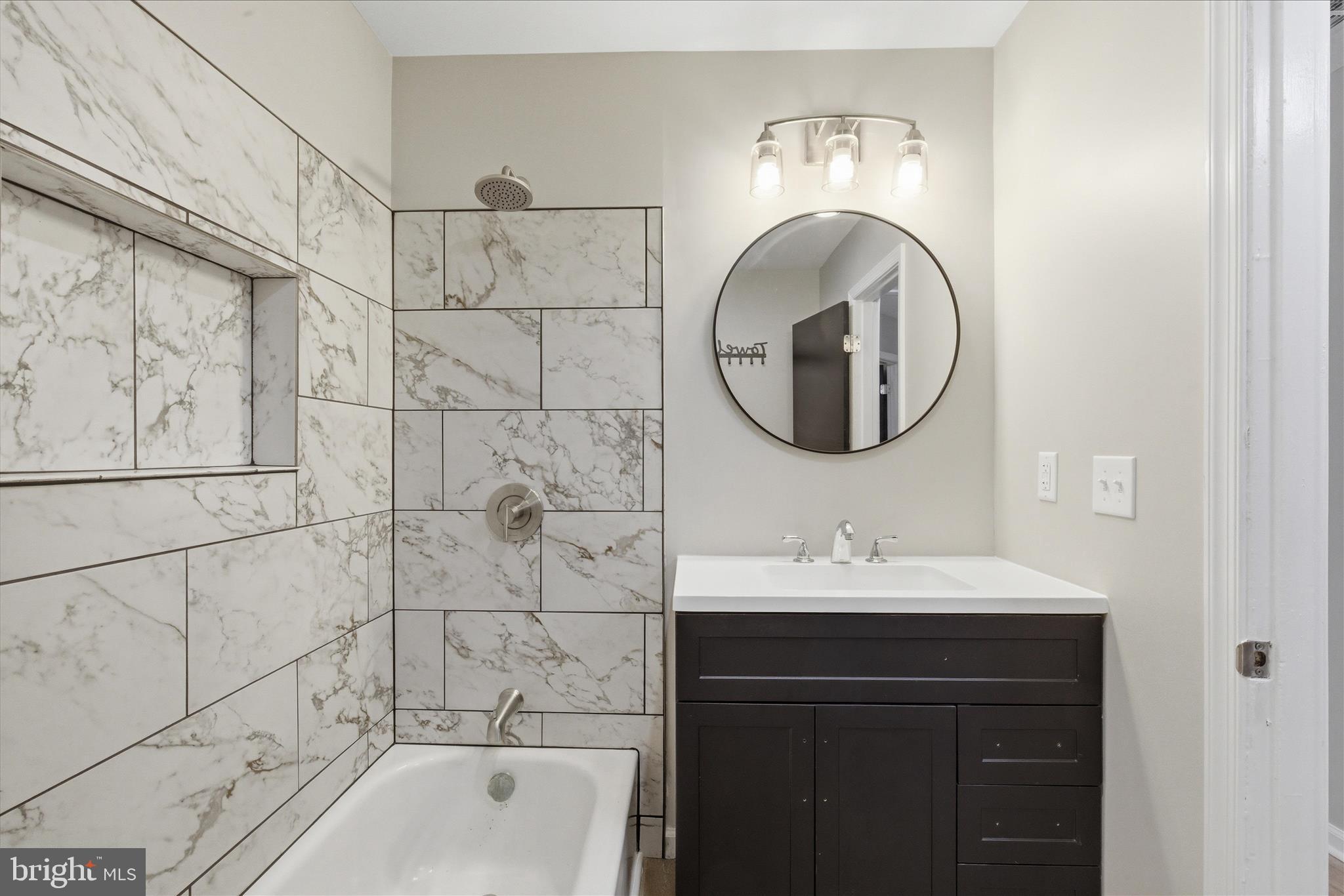 6815 Marshall Road St. Leonard, MD 20685 - Photo 29 of 43 a bathroom with a sink and a mirror