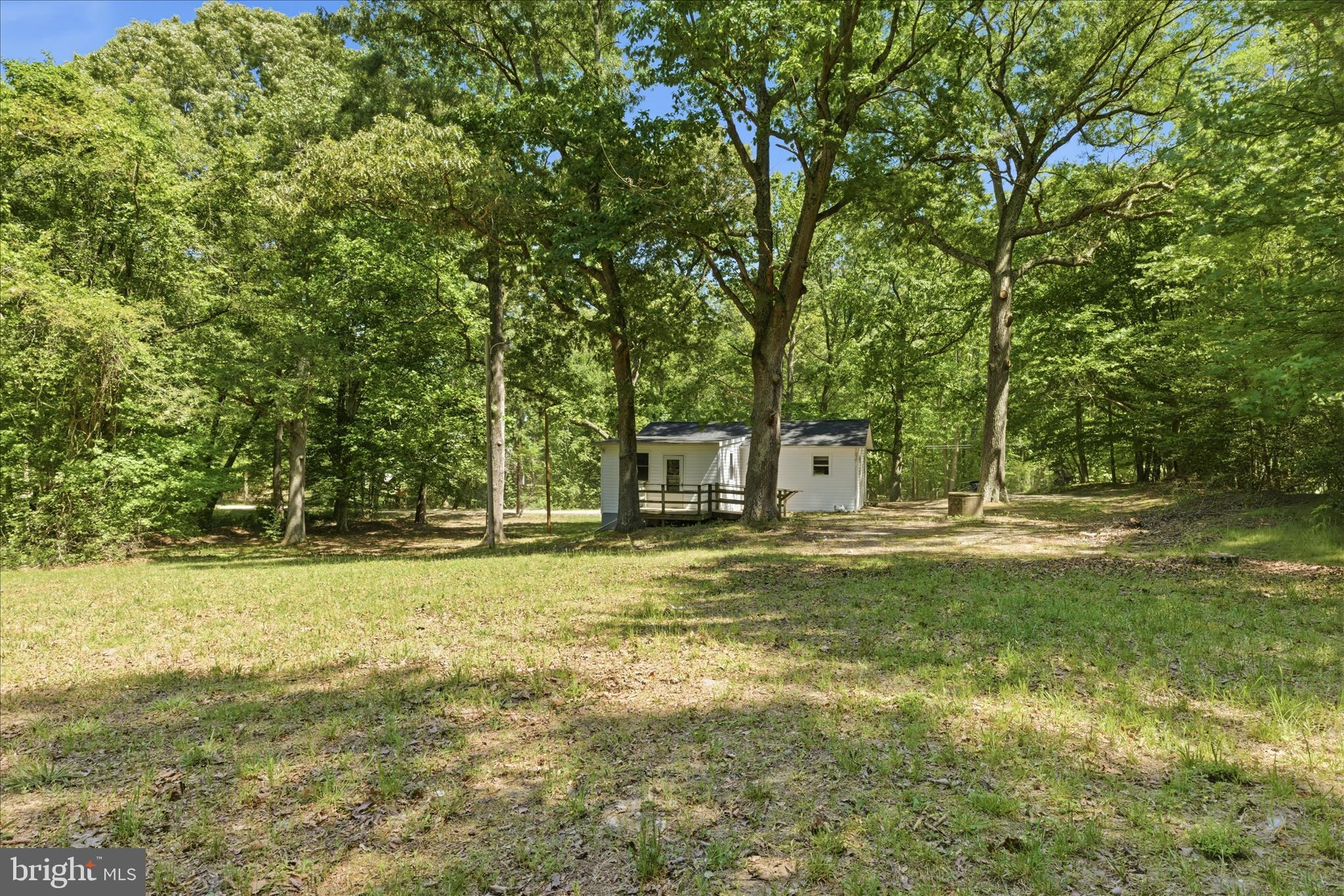 6815 Marshall Road St. Leonard, MD 20685 - Photo 39 of 43 a swimming pool with trees in the background