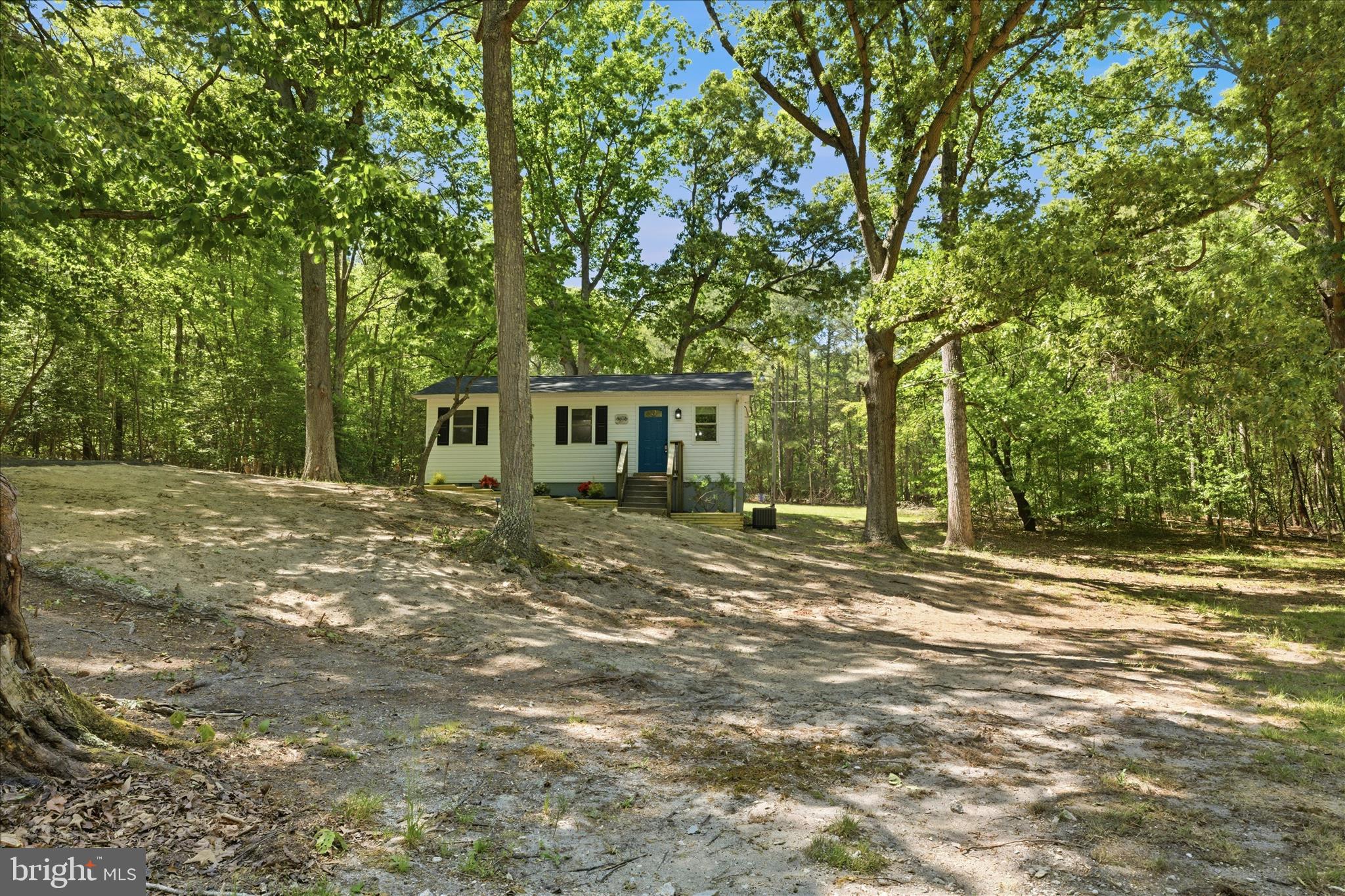 6815 Marshall Road St. Leonard, MD 20685 - Photo 41 of 43 a view of a house with a tree in the yard
