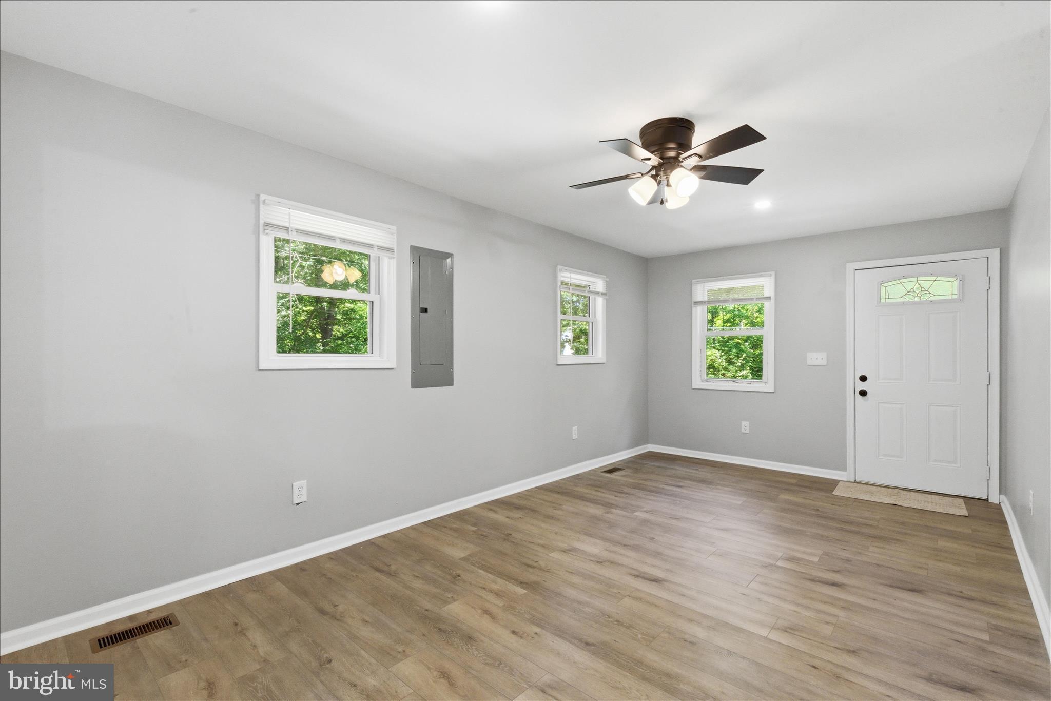 6815 Marshall Road St. Leonard, MD 20685 - Photo 7 of 43 wooden floor in an empty room with a window